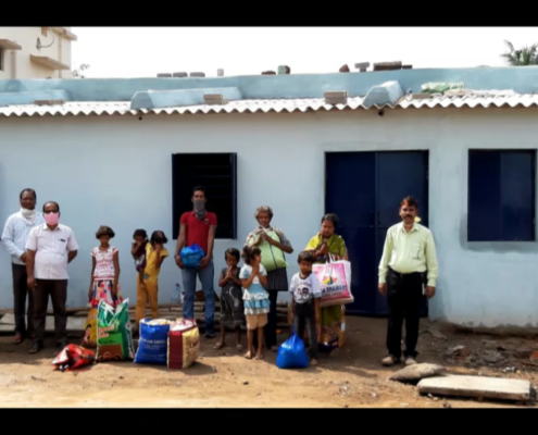 The Patra familiy in front of their new home